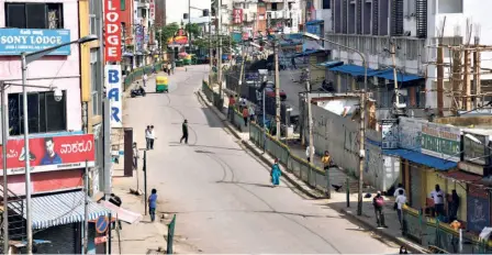  ??  ?? KALASIPALA­YAM Main Road after the Bruhat Bengaluru Mahanagara Palike sealed it off following the rapid spread of COVID in the city, on June 23.