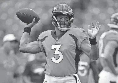  ?? ADRIAN KRAUS/AP ?? Broncos quarterbac­k Russell Wilson warms up before a preseason game against the Bills on Aug. 20 in Orchard Park, N.Y.