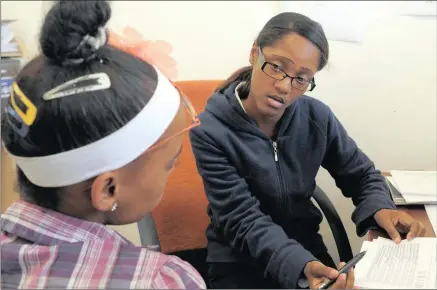  ??  ?? CHECKS AND BALANCES: Social worker Anthea Peters counsels a patient as Western Cape Minister of Health Nomafrench Mbombo pays an unannounce­d visit to Heideveld Emergency Centre.