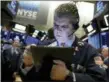  ?? RICHARD DREW — THE ASSOCIATED PRESS FILE ?? Trader John Panin works on the floor of the New York Stock Exchange.