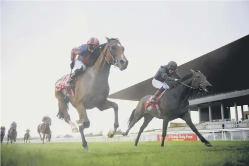  ?? PICTURE: PA ?? 0 Santiago, ridden by Seamie Heffernan, wins the Dubai Duty Free Irish Derby at the Curragh on Saturday.