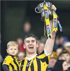  ?? (Photo: Piaras Ó Mídheach/Sportsfile) ?? Pat Hartley, of Tullogher-Rosbercon, lifts the All-Ireland junior cup alongside his son JP, after their side’s victory in the AIB GAA Hurling All-Ireland Junior Club Championsh­ip final match versus St Catherine’s at Croke Park in Dublin. Hartley was also named man of the match.