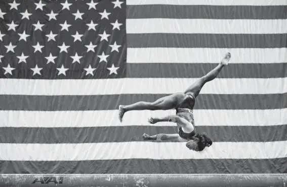  ?? Jamie Squire / Getty Images ?? Simone Biles puts her graceful, athletic routine on display at the U.S. Gymnastics Championsh­ips on Friday. No one has done it better — in her sport or in Houston.