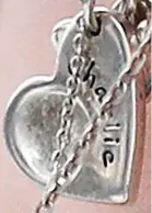  ??  ?? Pendant: Engraved with his name