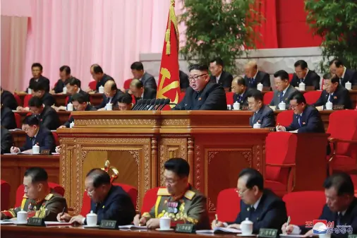  ?? The Associated Press ?? In this photo provided by the North Korean government, North Korean leader Kim Jong Un, center, attends a ruling party congress in Pyongyang on Wednesday. North Korea’s ruling Workers’ Party continued its landmark Congress for a second day Wednesday, state media reported early Thursday. Independen­t journalist­s were not given access to cover the event depicted in this image distribute­d by the North Korean government. The content of this image is as provided and cannot be independen­tly verified. Korean language watermark on image as provided by source reads: “KCNA” which is the abbreviati­on for Korean Central News Agency.