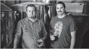  ??  ?? John Oglesbee, left, and Jack Buttram, owners of Oil Horse Brewing, opened Longview’s only brewery.