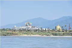  ??  ?? A Chinese-run casino on the bank of the Mekong in Laos.