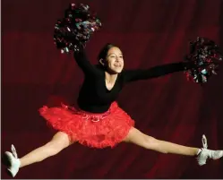  ??  ?? Jaqueline Prado dances to a patriotic cheer medley Saturday during the pageant at the Portervill­e Memorial Auditorium.