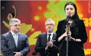  ??  ?? Iranian actress Baran Rasoulof speaks on behalf of director Mohammad Rasoulof who was awarded the Golden Bear for Best Film at the Berlinale film festival in Berlin.