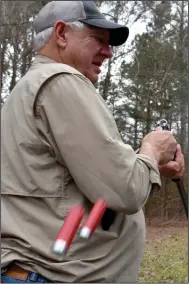  ?? (Arkansas Democrat-Gazette/Bryan Hendricks) ?? Bob Rogers of Maumelle ejects spent hulls from his Winchester 101 on Wednesday at the Remington Gun Club’s sporting clays course near Lonoke.