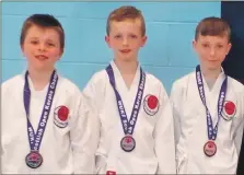  ?? Neil. Photograph: Rabe ?? Team Oban Under 11s, from left, Logan Higgins, Oliver Gillies and Sean Craik with their bronze medals.