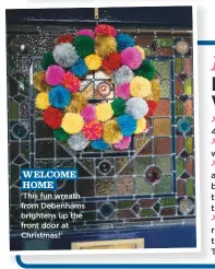  ??  ?? WELCOME HOME ‘This fun wreath from Debenhams brightens up the front door at Christmas!’