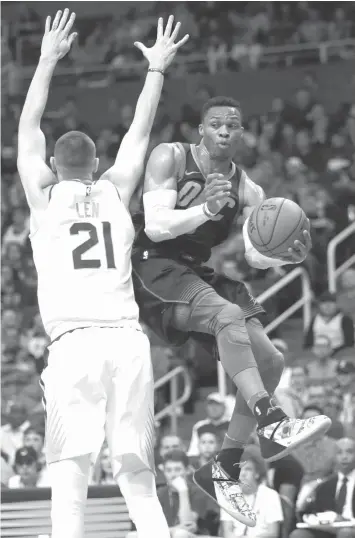  ?? ASSOCIATED PRESS ?? Oklahoma City Thunder guard Russell Westbrook drives past Phoenix Suns center Alex Len in the first half during an NBA basketball game in Phoenix.