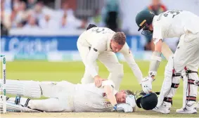  ??  ?? ■ Australia’s Steve Smith on the floor after being struck by Jofra Archer’s delivery