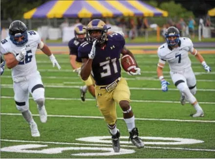  ?? PETE BANNAN — DIGITAL FIRST MEDIA ?? Runaway: West Chester University running back Mark Dukes crosses the 50-yard line en route to a 57-yard touchdown run to open the scoring for the Golden Rams in a 51-9 victory over Bentley Thursday evening at Farrell stadium.