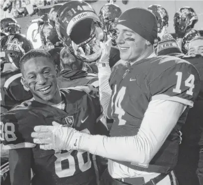  ??  ?? Jake Marwede (right) rushed for two touchdowns in Loyola’s 41-0 win over Marist in the Class 8A state title game Saturday.