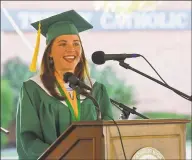  ??  ?? Valedictor­ian Fiona Willette addresses her Trinity Catholic classmates on Thursday.