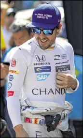  ?? CHRIS GRAYTHEN / GETTY IMAGES ?? Fernando Alonso, the betting favorite in some circles, says today will mark his first rolling start in a race since his go-kart days.