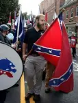  ??  ?? PROTEST: White supremacis­ts carry a Confederat­e flag