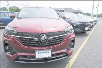  ?? CHARLES KRUPA — THE ASSOCIATED PRESS ?? New Buick Encore SUVs at the Albrecht Auto Group dealership in Wakefield, Mass., on Tuesday.