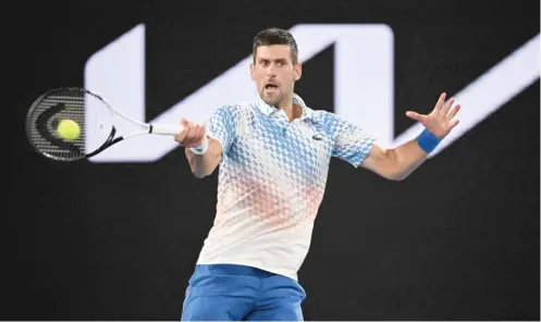  ?? WILLIAM WEST/GETTY IMAGES ?? Novak Djokovic lines up a return during his straight-set victory Friday against Tommy Paul in the semifinals of the Australian Open in Melbourne.