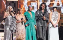  ?? MATT SAYLES/INVISION ?? From left, Lady Gaga, Jada Pinkett Smith, Alicia Keys, Michelle Obama and Jennifer Lopez appear at the 61st annual Grammy Awards on Sunday in Los Angeles.