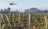  ??  ?? Above: at Château Figeac in a cold April 2017, a helicopter circulates warmer air to prevent frost damage to the vineyard