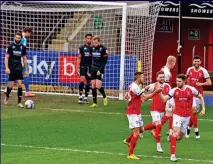  ?? MIKE SEWELL ?? Long shot: Cheltenham defender Sean Long makes it 1-0 from Tozer’s throw-in