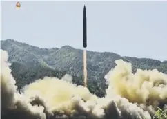  ??  ?? 0 The Hwasong-14 missile leaves the launch pad in North Korea