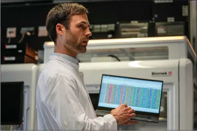  ?? (AP/Martin Meissner) ?? Dr. Axel Schmidt, co-author of a study from the Institute of Human Genetics at the University Hospital, shows the genome of Beethoven on a computer screen March 21 during an interview with The Associated Press in Bonn.