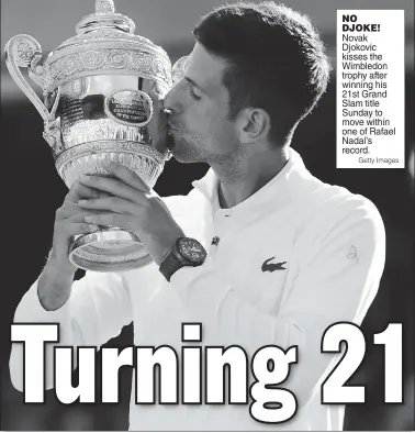  ?? Getty Images ?? NO DJOKE! Novak Djokovic kisses the Wimbledon trophy after winning his 21st Grand Slam title Sunday to move within one of Rafael Nadal’s record.