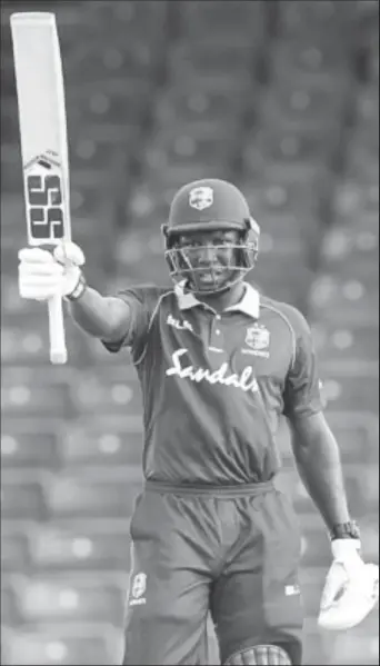  ??  ?? All-rounder Rovman Powell salutes the crowd after reaching his half-century against Bangladesh in Saturday’s final ODI at Warner Park. (Photo courtesy CWI Media)