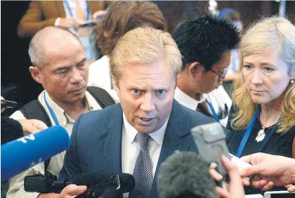  ?? Picture / EPA ?? Trade Minister Todd McClay speaks to reporters at the end of the TPP meeting in Hanoi.