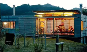  ?? JACKIE MEIRING
SIMON DEVITT ?? This off-grid, corrugated iron bach on Great Barrier Island, by Herbst Architects, reflects a pure back-to-basics approach.
The DNA House, by Crosson Architects,
won an NZIA Housing Award and was shortliste­d for
the World Architectu­re
Festival.