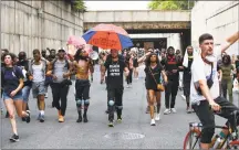  ?? Alex Brandon / Associated Press ?? Demonstrat­ors walk through the 9th Street tunnel as they protest Saturday in Washington, over the death of George Floyd, a black man who was in police custody in Minneapoli­s.