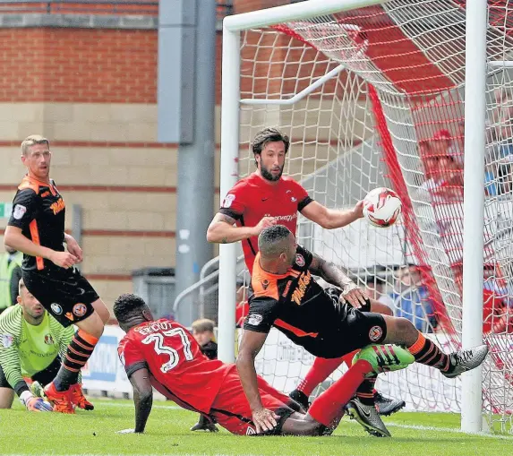  ??  ?? Jamie Turley fires the ball home to clinch Newport’s win at Leyton Orient PICTURE: Huw Evans Agency