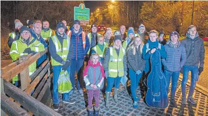  ?? Picture: Kenny Smith. ?? Parents of pupils in Glenrothes who face losing entitlemen­t to school buses gathered and walked the route alongside the A92 suggested by Fife Council.