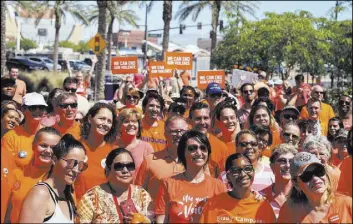  ?? Rio Lacanlale Las Vegas Review-Journal ?? At least 100 people gathered Saturday at the Las Vegas Community Healing Garden for the Wear Orange anti-gun violence event.