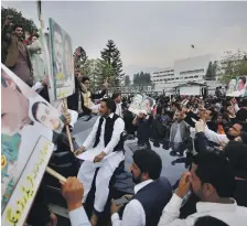  ?? AP ?? Imran Khan’s supporters celebrate after the prime minister won a vote of confidence in Pakistan’s National Assembly