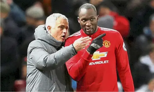  ??  ?? Difficult times: Manchester United manager Jose Mourinho giving instructio­ns to Romelu Lukaku during the Premier League match against Manchester City on Dec 10. — Reuters