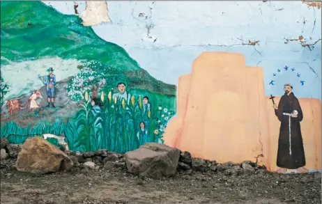  ?? MORGAN TIMMS/Taos News ?? A mural depicting the San Francisco de Asís Mission Church and surroundin­g farmlands quintessen­tial to Ranchos de Taos is seen off State Road 68, Tuesday (March 30).