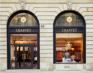  ??  ?? Left: the finished Charvet product, hand-crafted exclusivel­y for its wearer following 20 different measuremen­t recordings and two separate fittings Above: Charvet’s imposing shopfront at 28 Place Vendôme, Paris