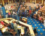  ?? Kent Nishimura Los Angeles Times ?? MEMBERS of the new Congress on Sunday in the House, where senators will join them for the tally.