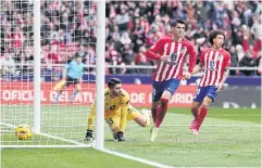  ?? AFP ?? Atletico Madrid’s Alvaro Morata, centre, celebrates scoring his team’s second goal against Real Betis.