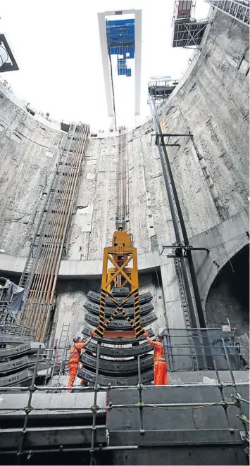  ?? Picture: GALLO/GETTY ?? GOING UNDER: Crossrail workers unload concrete segments to line the tunnel, in a 40m-deep shaft at the Limmo Peninsula site in London, England
