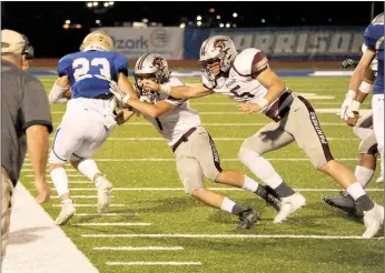  ?? Lee Dunlap/Special to Siloam Sunday ?? Harrison senior running back Gabe Huskey runs down the home sideline as Elijah Coffey and Cam Collins attempt to make a tackle during Friday’s game at Harrison. The Goblins defeated the Panthers 33-7.