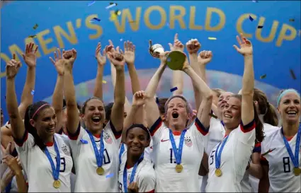  ?? AP Photo/Alessandra Tarantino ?? In this 2019 file photo, United States’ Megan Rapinoe lifts up a trophy after winning the Women’s World Cup final soccer match between US and The Netherland­s at the Stade de Lyon in Decines, outside Lyon, France.
