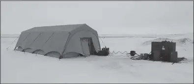  ?? ?? TESTING THE TENT— The prototype medical tent, a UTS TM60 Tall, and generator were set up outside the Army Aviation Operations Facility, near the Nome airport.