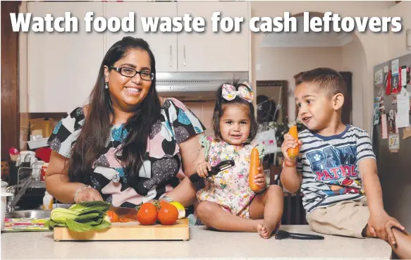  ??  ?? DINNER WINNER: Zita Singh-Gosai with daughter Shenali, 1, and son Nevaan, 3, prepare dinner with a plan in mind for leftovers. Picture: Jonathan Ng