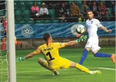  ?? AP ?? Greece’s Kostas Fortounis scores his side’s eventual winner against Estonia at A. Le Coq Arena stadium. Greece won 1-0.